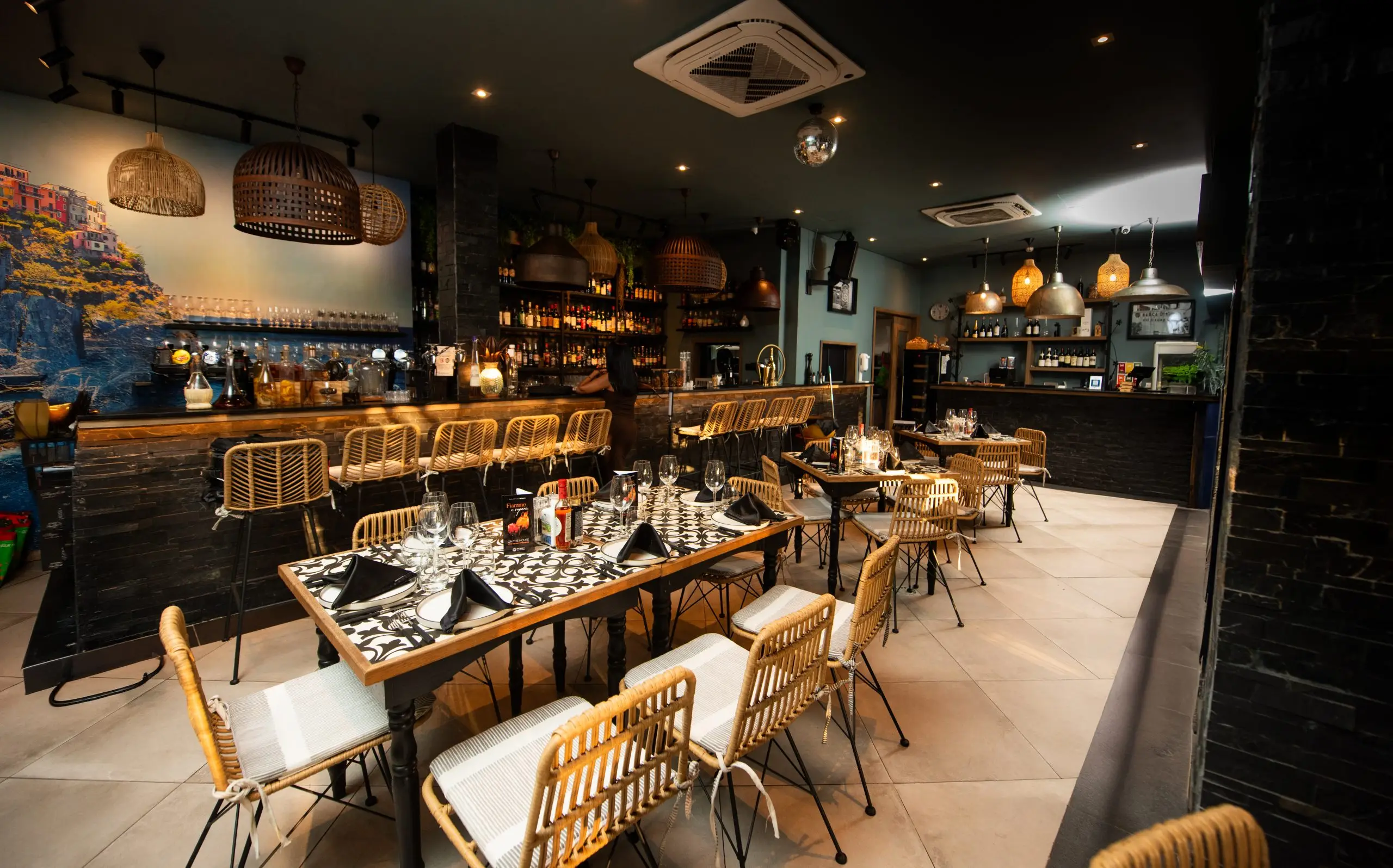Botteghita's warmly lit dining room and bar in Grand Baie, Mauritius